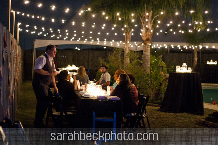 DIY circus backyard wedding reception under glowing lights